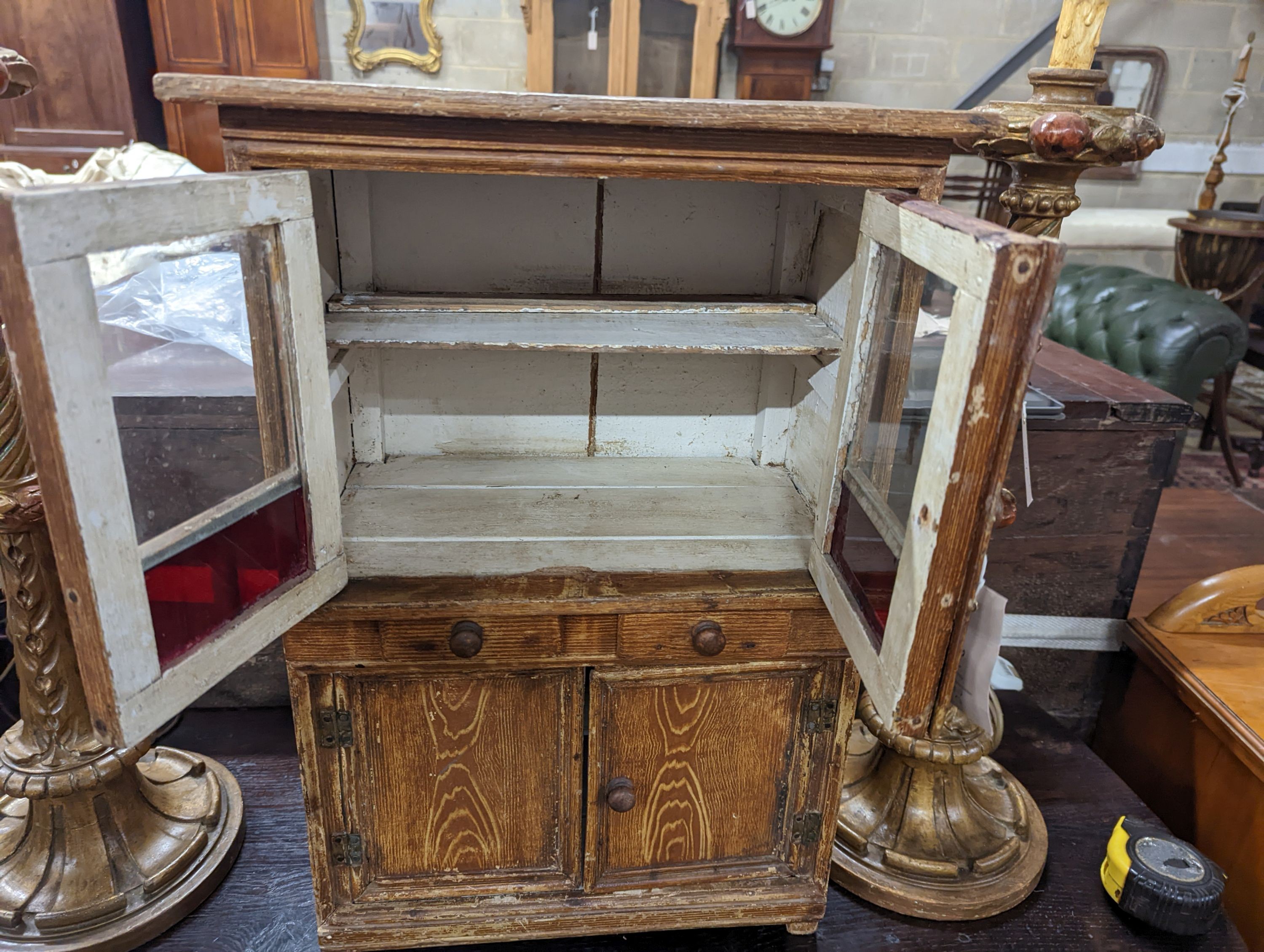 A 19th century Continental grained pine miniature dresser, width 39cm, depth 24cm, height 56cm